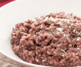 Risotto di riso rosso e orzo con pe...