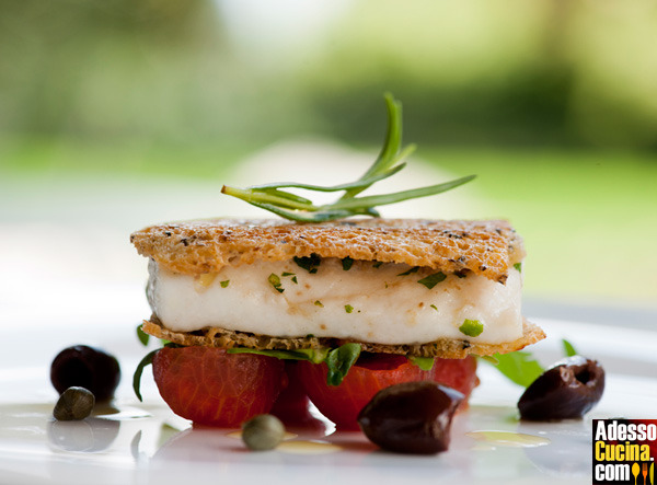 Spigola in crosta di pan di molche, pomodorini e rucola - Ricetta