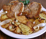 Braciole di maiale al forno con patate